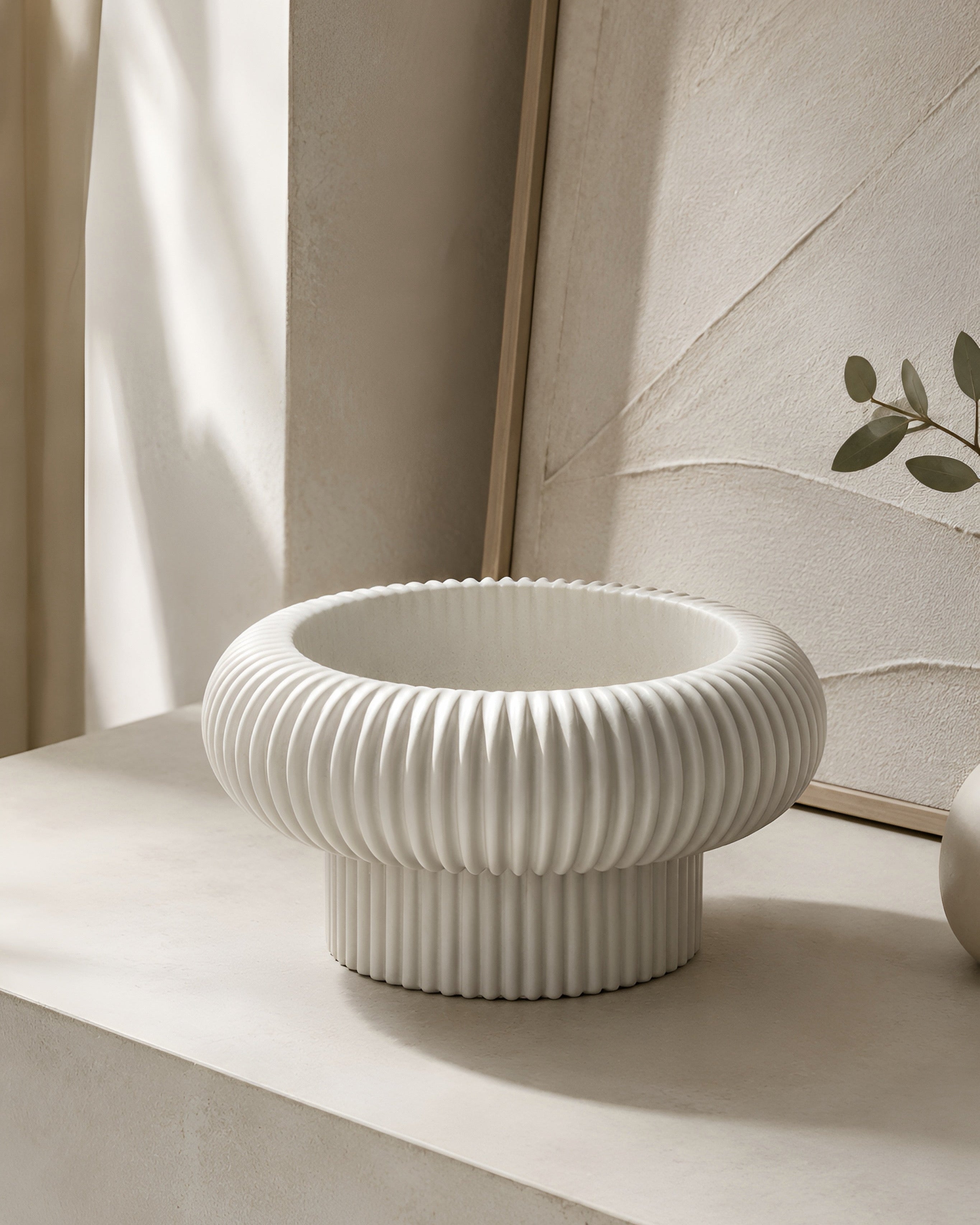 The Opra ribbed pedestal bowl