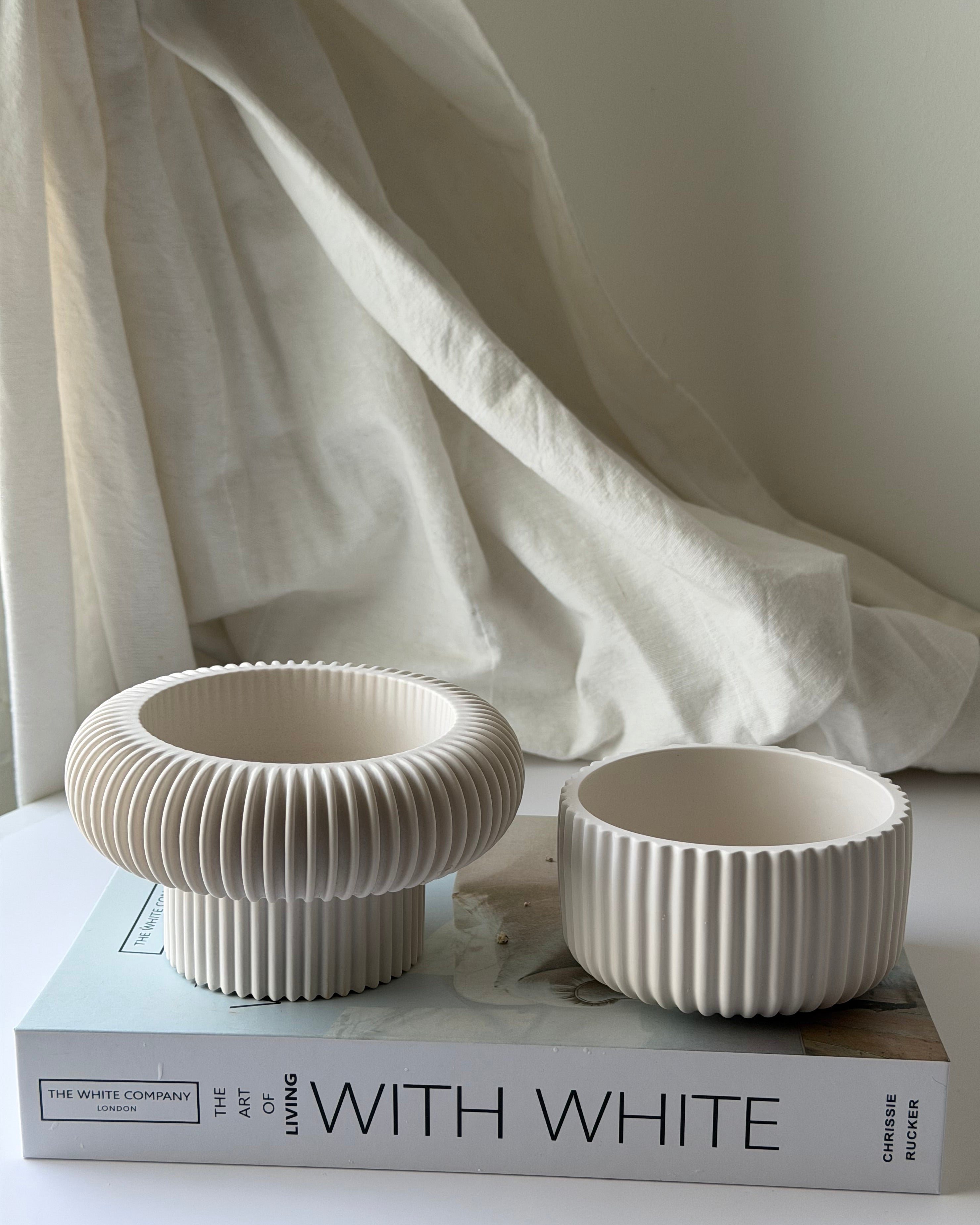 The Opra ribbed pedestal bowl