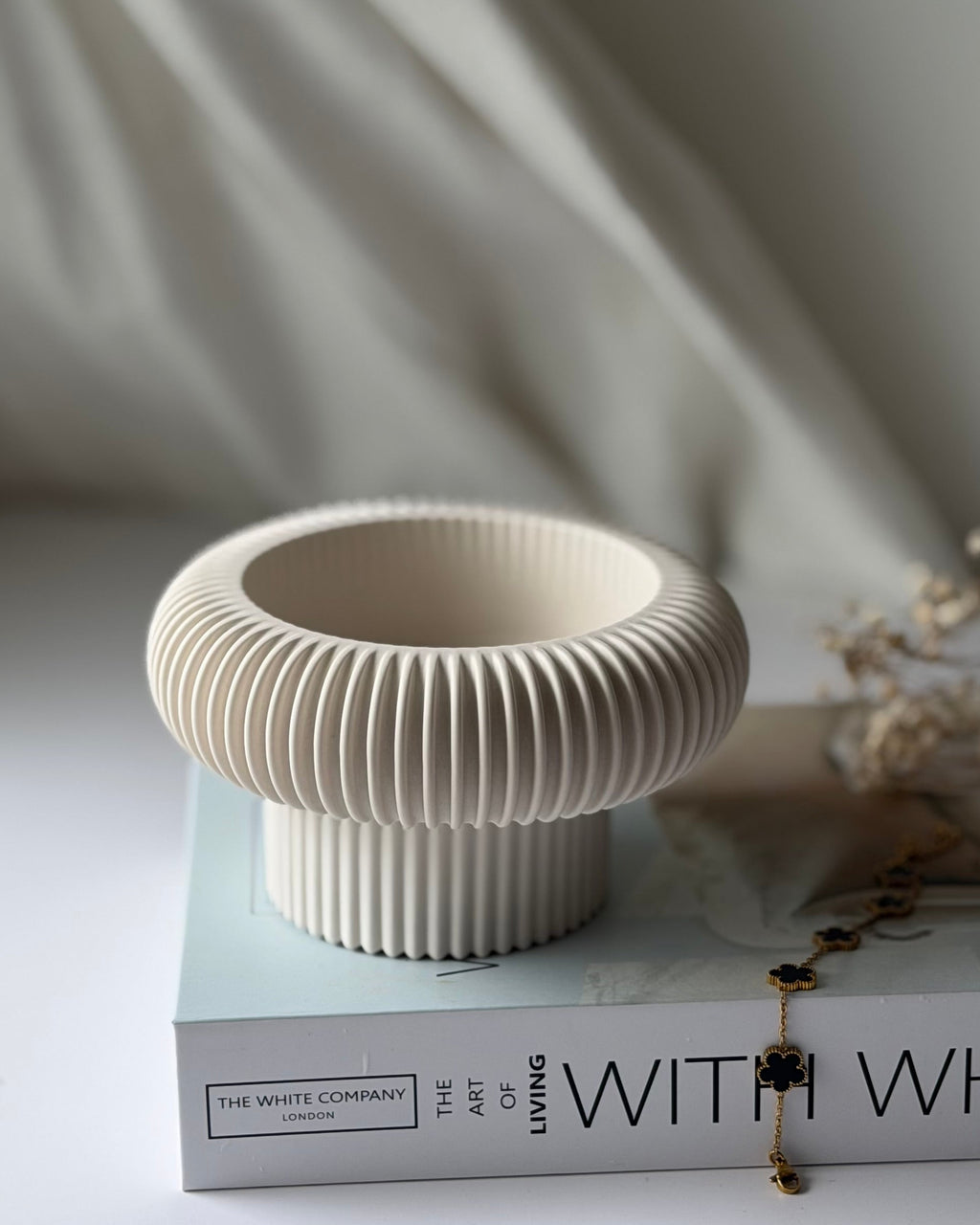 The Opra ribbed pedestal bowl