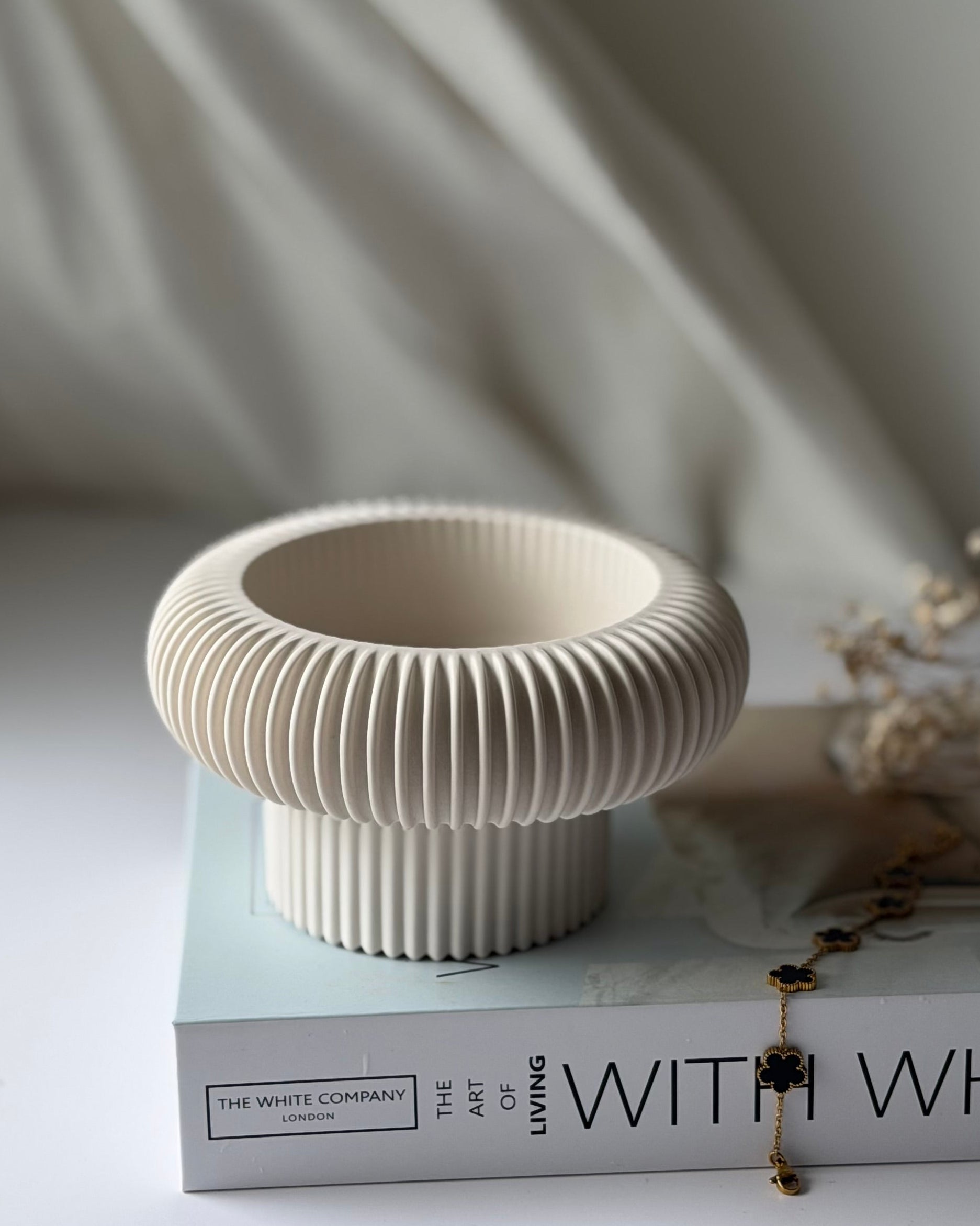 The Opra ribbed pedestal bowl